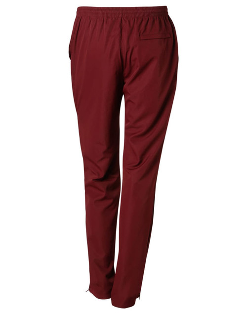 Maroon kid's track pants with an elastic waistband and pockets, featuring a logo on the back.