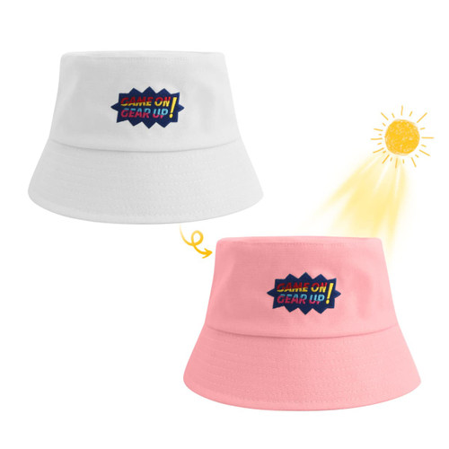 A colour changing bucket hat in white that changes to pink in sunlight, featuring a logo on the front.