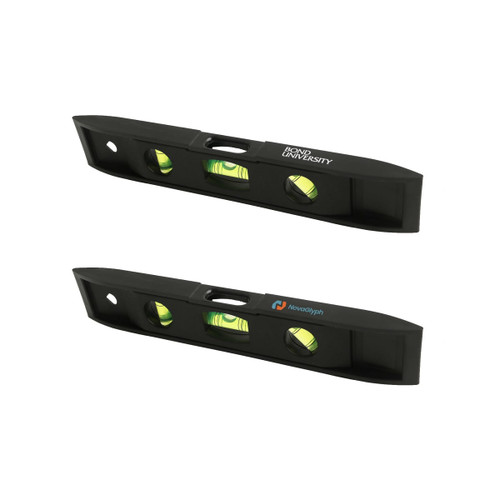 A black magnetic torpedo level featuring two spirit vials and logos on either side.