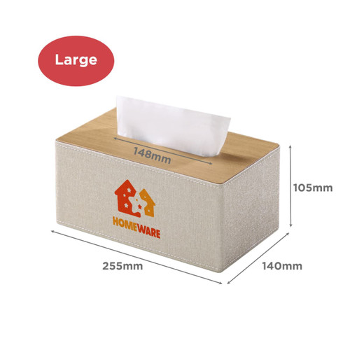 A large tissue box with a light beige fabric exterior and wooden top, featuring a logo. Dimensions are listed.
