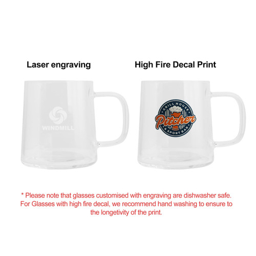 A glass mug with a clear design, featuring a logo and a colourful decal on one side.