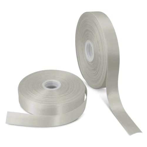 A roll of personalised ribbon in a soft, pale green colour alongside another roll, both on spools.