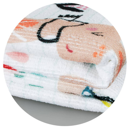 A folded Zen Yoga Towel featuring a playful design with soft pastel colours and a logo.