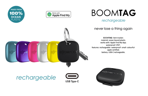 A collection of colourful Boomtag rechargeable trackers in various hues, featuring a USB Type-C port and a keyring attachment.