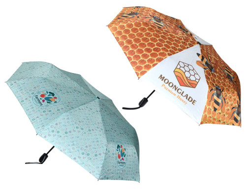 A full-colour umbrella featuring a honeycomb design and a pattern with small colourful icons. It has a logo on one panel.