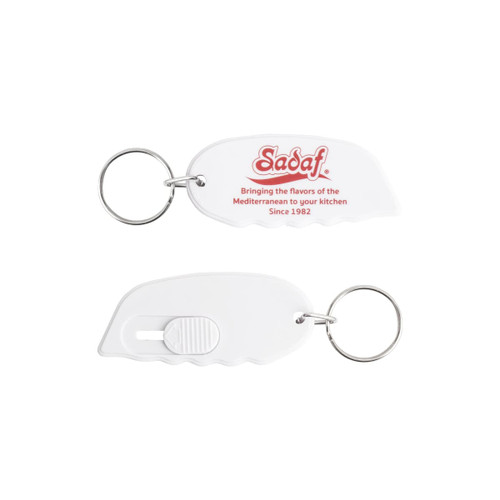 A white keyring in the shape of a mini cutter with a keychain attachment. It features a logo.