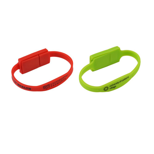 A red and a green slim silicone wristband flash drive, both featuring logos.