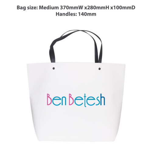 A medium white paper bag with a black handle, featuring a logo in blue and pink text. Dimensions are 370mm x 280mm x 100mm.