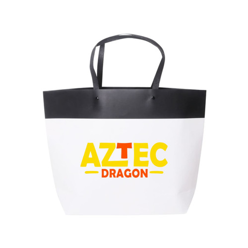 A medium black and white boutique paper bag featuring a logo and contrasting black handles.