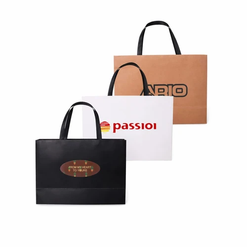Three large paper bags with flat handles in black, brown, and white, featuring various logos.