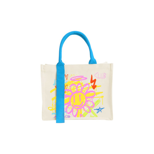 A cream tote bag with a bright blue handle, featuring a colourful, graffiti-style flower design and a logo.