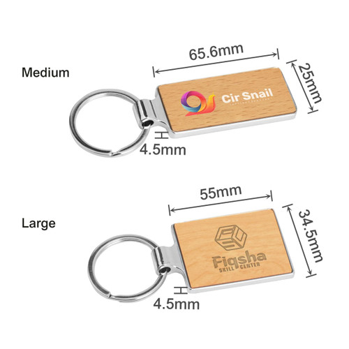 A wooden rectangle keyring with a metallic keyring attachment, featuring a logo and natural wood finish.