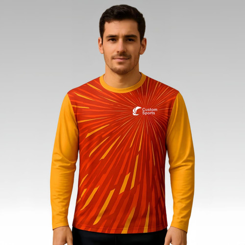 A long-sleeved shirt in red and yellow with a dynamic pattern and a logo on the front.