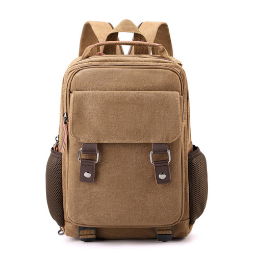 A tan canvas sling backpack with multiple pockets, adjustable straps, and a mesh side pocket. It has a logo on it.