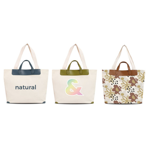 Three canvas bags with leather handles in cream, featuring different designs: text, a colourful symbol, and floral patterns.