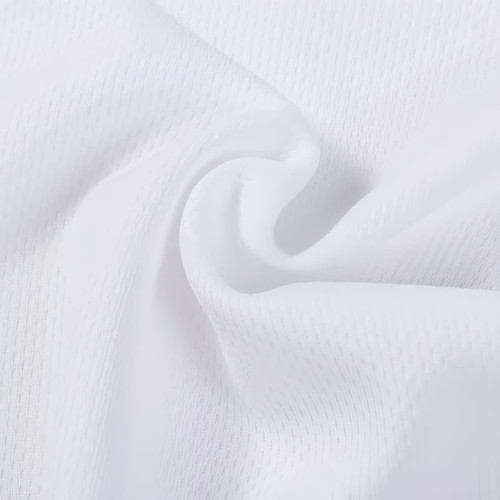 A close-up of white polyester fabric with a textured pattern, featuring a smooth, soft appearance.