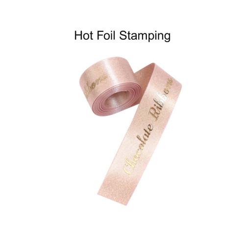 A roll of glittery gold satin ribbon, featuring a shiny finish and a branding logo.