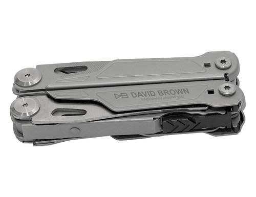 A grey multi-tool with various attachments, featuring a logo on its side. Compact design for easy portability.
