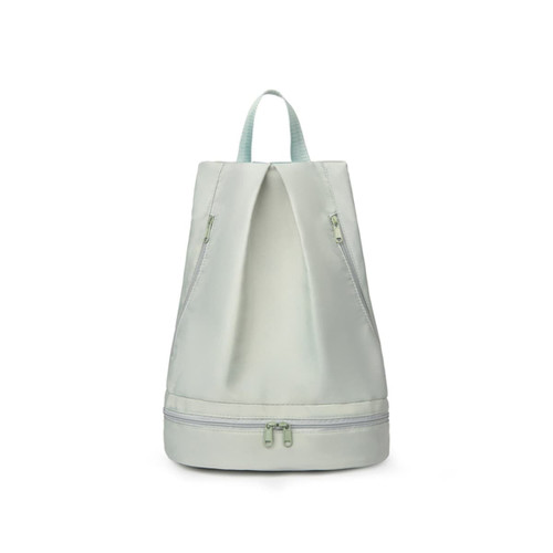 A pale green backpack with a dual zipper design, featuring a handle and a logo on the front.