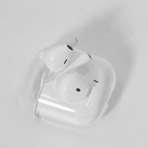 White noise cancellation earbuds in a clear case, featuring a simple design and a compact size.