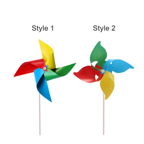 A colourful pinwheel featuring red, blue, yellow, and green blades, mounted on a white stick.
