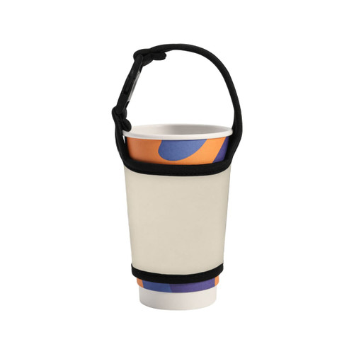 A drink bottle sleeve in cream with a black strap, holding a patterned disposable cup.