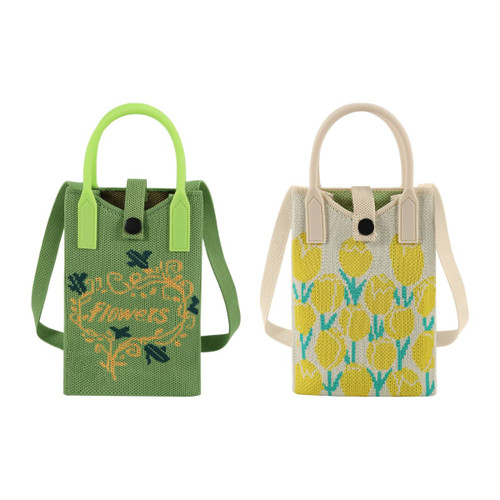 Two knitted phone crossbody bags in green and cream, featuring floral designs and handles. One has a logo.