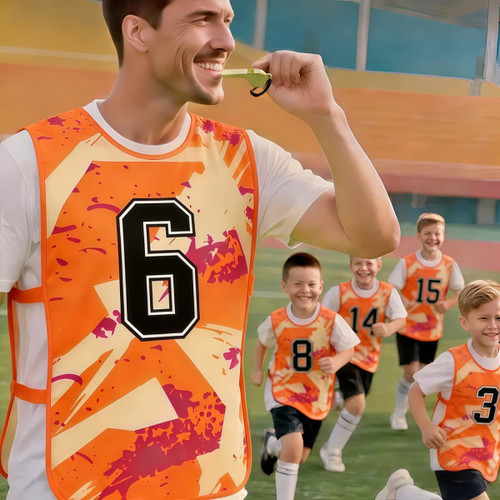 A vibrant orange training bib with a number and abstract design, worn by a man, with children running in the background.