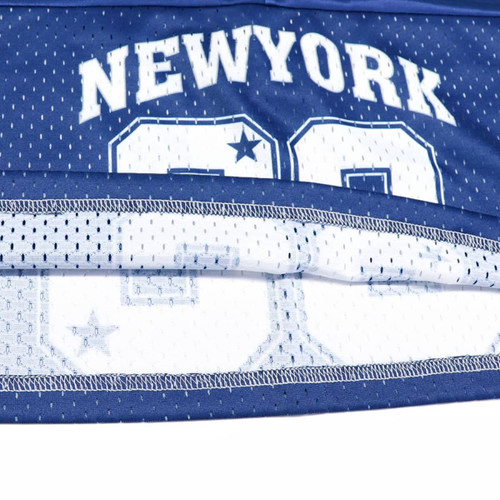 A blue sports jersey featuring a mesh design and a logo. The jersey includes a number and is made from 100% polyester.