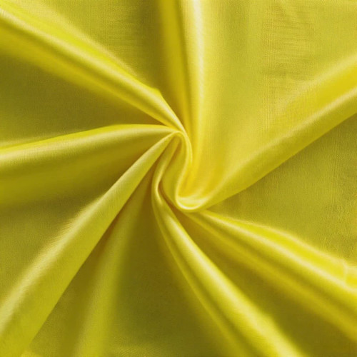 A vibrant yellow fabric featuring a smooth, shiny texture, suitable for training bibs. It has a logo design.