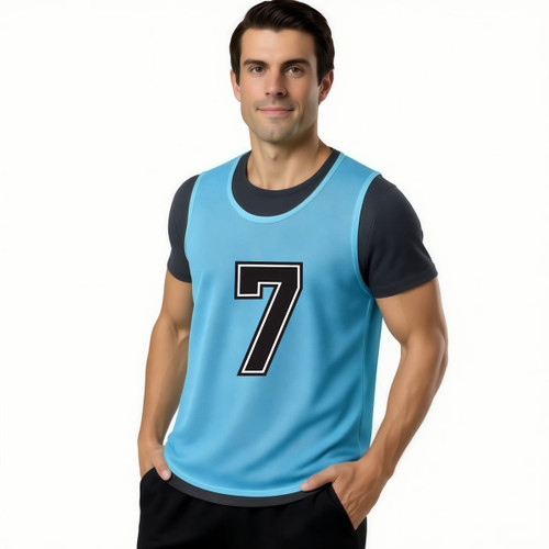 A blue polyester micro mesh training bib featuring the number 7, worn by a man. The bib has a logo.