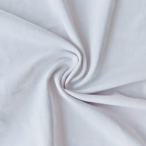 A close-up of smooth, white polyester-spandex fabric, showcasing its soft texture and stretchability.