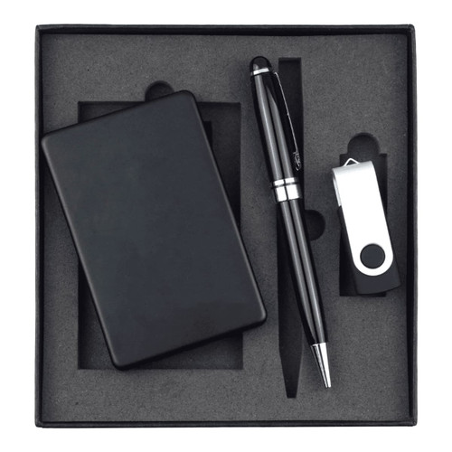A black power bank, USB drive, and pen arranged in a black gift box. The set is neatly positioned on grey foam.