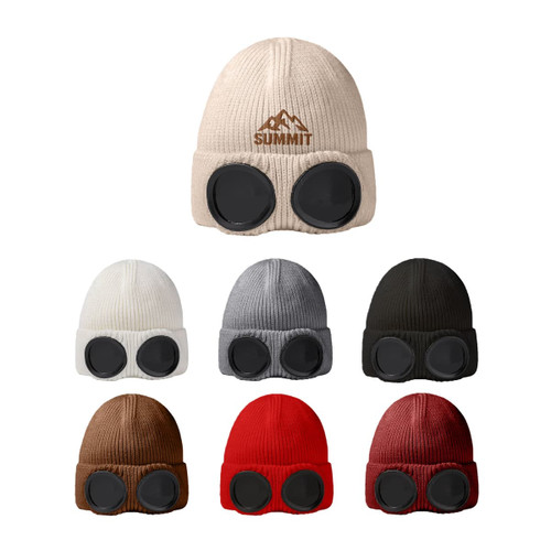 A collection of beanies in various colours, each featuring round goggles on the front and a logo.