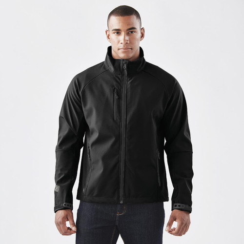 A black ultra-light shell jacket with a zip front and side pockets, featuring a logo on the sleeve.