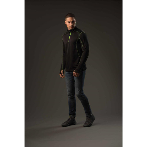 A men's black polar fleece pullover with green accents, displayed on a model against a dark background.