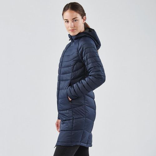 A navy women's parka jacket with a hood, featuring a quilted design and side pockets. It has a logo on it.