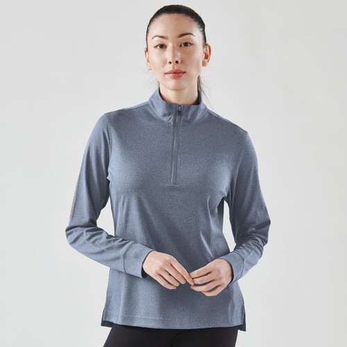 A women's blue 1/4 zip pullover jumper with long sleeves, featuring a subtle texture and a branding logo.
