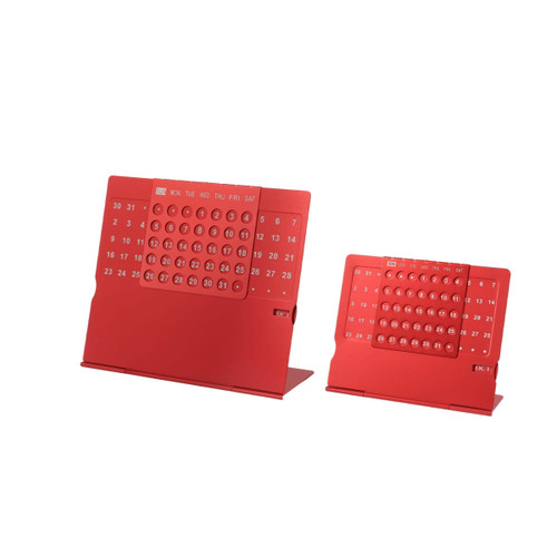 A red aluminium desk calendar with two sizes, featuring large date and day grids and a branding logo.