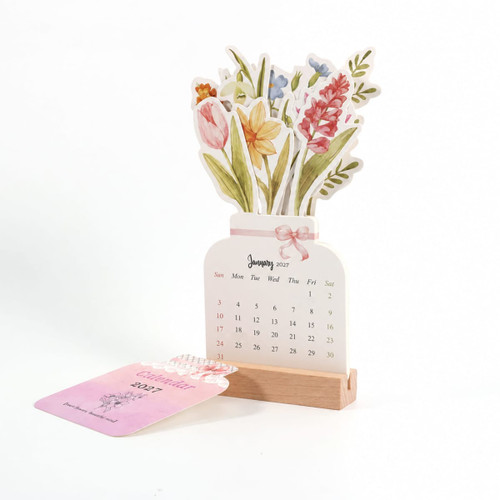 A floral desk calendar with a wooden stand, featuring colourful flowers and a monthly calendar display for January.