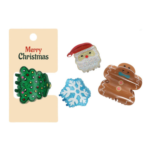 A set of three Christmas-themed hair claws featuring a tree, Santa, and a gingerbread man in festive colours.