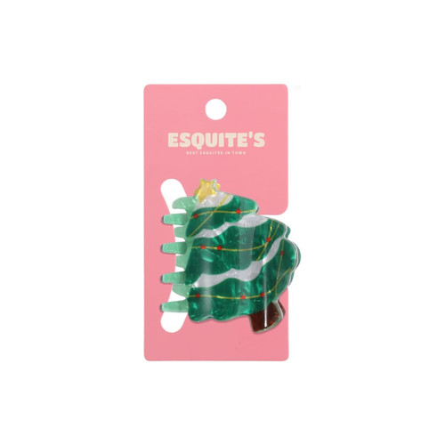 A green Christmas tree hair claw with decorations on a pink backer. Features a branding logo.