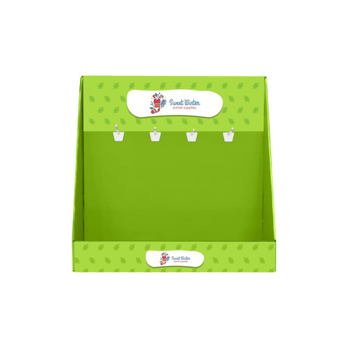 A green corrugated cardboard display with hooks for hanging items, featuring a logo at the top.