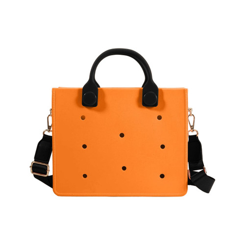 An orange casual tote bag with black handles and a detachable strap, featuring evenly spaced holes throughout.