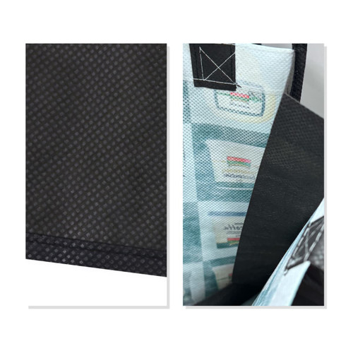 A small tote bag in black with a patterned interior and a logo, showcasing a textured surface.