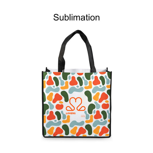 A vibrant tote bag featuring an abstract pattern in green, orange, and blue, with black handles and a logo.