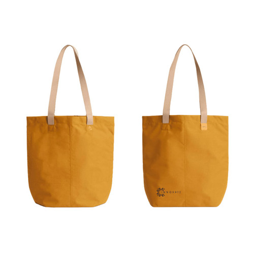 A yellow tote bag with light-coloured straps and a logo on one side. Simple and stylish design.