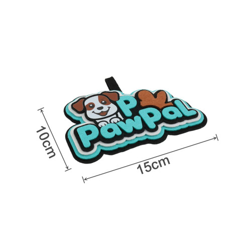 A custom felt hanging tag in turquoise, black, and brown, featuring a dog and the text "PawPal". Measures 15cm by 10cm.