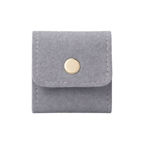 A grey synthetic leather jewellery bag with a gold button closure and stitched detailing.