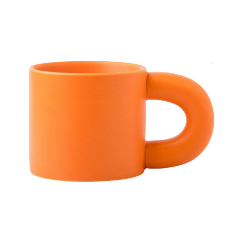 An orange ceramic coffee mug with a smooth finish and a rounded handle. It features a logo on one side.